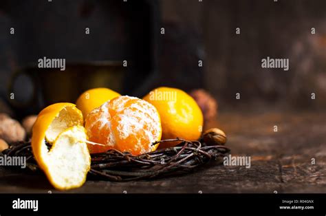 Orange With Peeled Skin Against Rustic Background Stock Photo Alamy