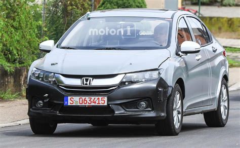 Use for comparison purposes only. Honda City Test Mule Spotted Hiding Future Hybrid Tech