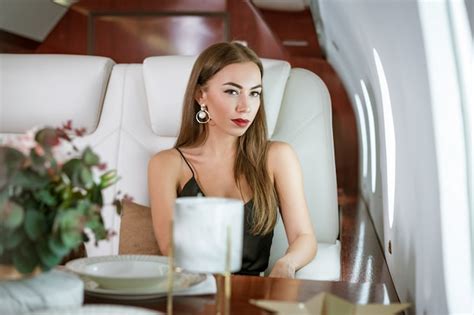 premium photo beautiful rich woman in a private first class plane