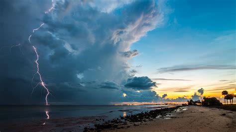 Download 3840x2160 Sky Clouds Lightning Beach Ocean Thunderstorm