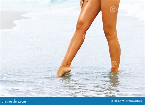 Beautiful Woman Legs On The Beach In Water Stock Photo Image Of