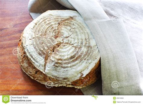 loaf-of-fresh-spelt-flour-bread-in-kitchen-towel-stock-photo-image-of-food,-tradition-25615950
