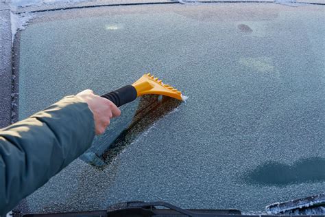Scraping Ice Off A Windshield 2222963 Stock Photo At Vecteezy