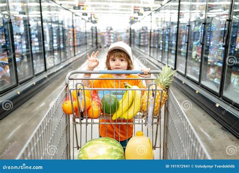 Toddler Boy With Shopping Bag In Supermarket Child Shopping In