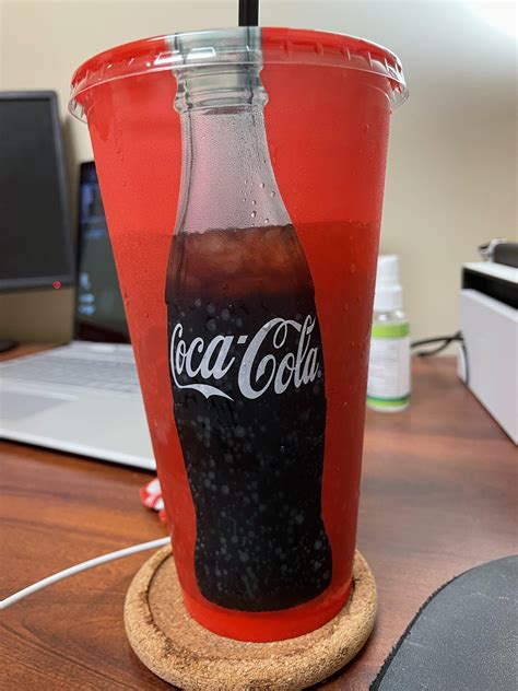 The Coke Bottle On This Cup Is Transparent So The Bottle Empties As You