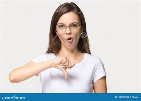 Disappointed Girl In Glasses Show Thumbs Down Gesture Stock Image