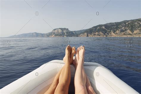 Beautiful Girl Friends Feet Travel On Speed Boat To Paradise Island For