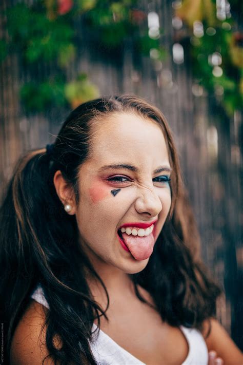 Teenager Girl With Punk Makeup Sticking Out Tongue By Victor Torres