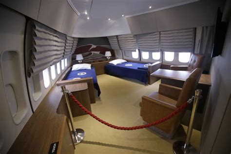 In this photo, president george w. Air Force 1 replica takes visitors inside presidential 747 ...