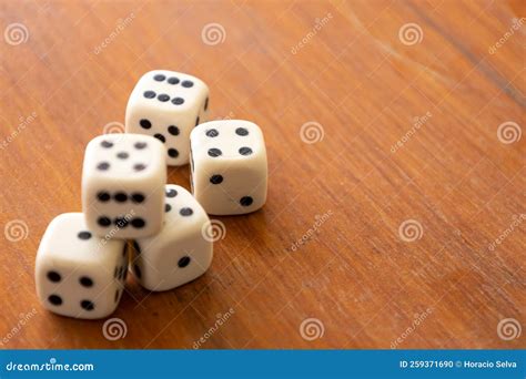 Numbered Plastic Pieces On A Table Board Game Called Dice Stock Photo