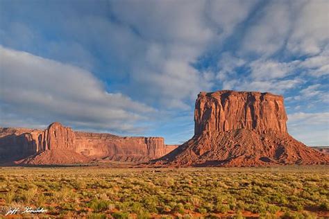 Monument Valley On The Arizonautah Border Epitomizes The Essence Of