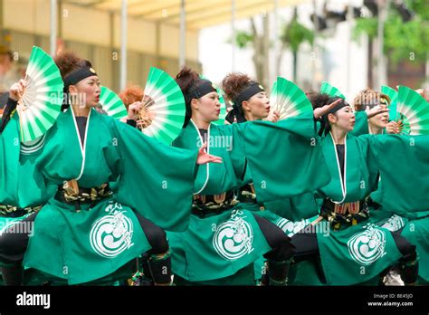 Colourful Dancers With Traditional Japanese Fans At The Annual Yosakoi