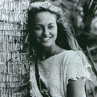 Black And White Photograph Of A Woman Leaning Against A Palm Tree
