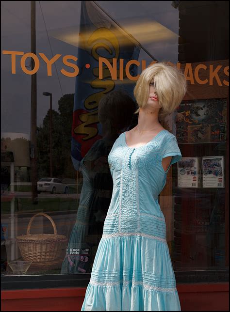 Assistant store manager at dress barn. Armless mannequin in front of Wells Street Variety Store ...