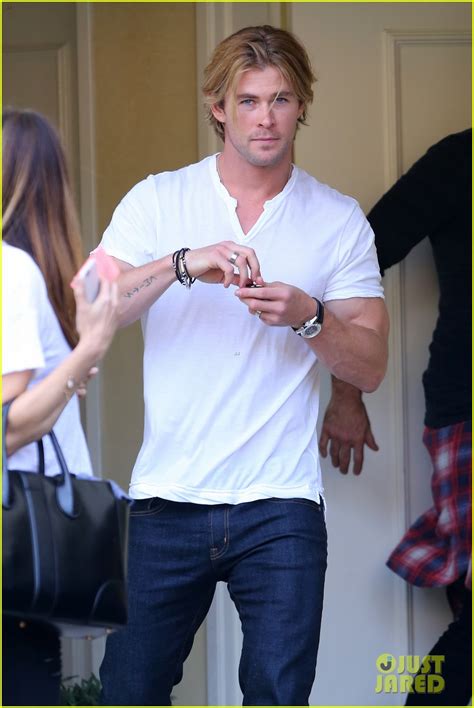 Chris Hemsworth Lets His Muscles Bulge Out Of His White