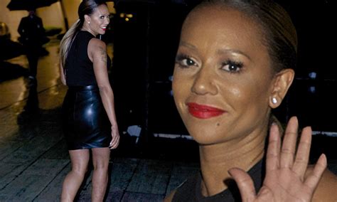 Mel B Sizzles In A Leather Mini Skirt As She Steps Out For Dinner Under A Huge Umbrella During A