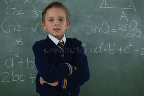 Schoolboy Standing Arms Crossed Against Chalkboard Stock Image Image