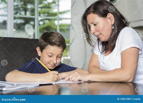 Mother Helping Son With Homework At Table Stock Image Image Of Women