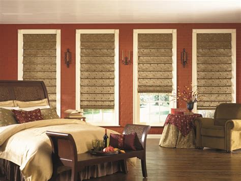 Properly installed window blinds and shades can create the illusion of a large room. Chic blackout roman shades in Bedroom Mediterranean with ...