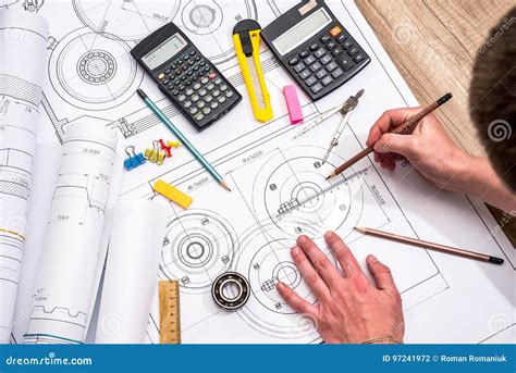 Mechanical Engineer With Work At Technical Drawings Stock Photo Image
