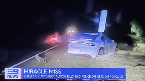 Tesla Driver On Autopilot Crashes Into Police Car Two Officers In The