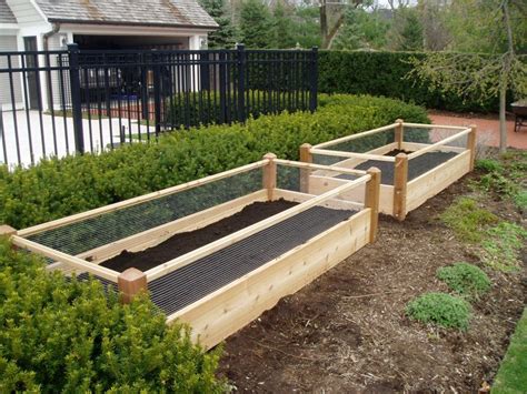 Rabbits will chew through it. Two Raised Garden Beds with Rabbit Railing 3x8x2 ...