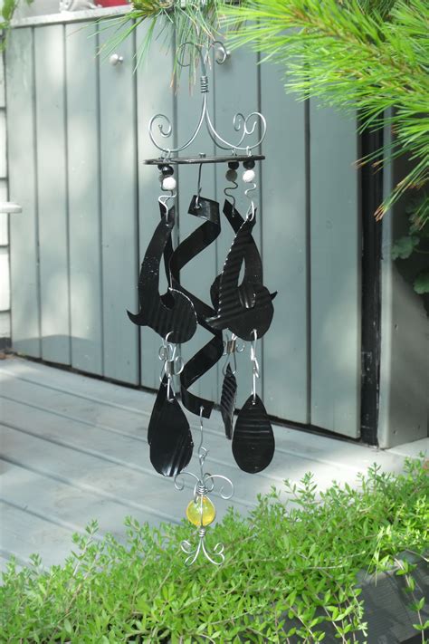 tin can art, wind chime made from recycled tin cans. | Recycled tin