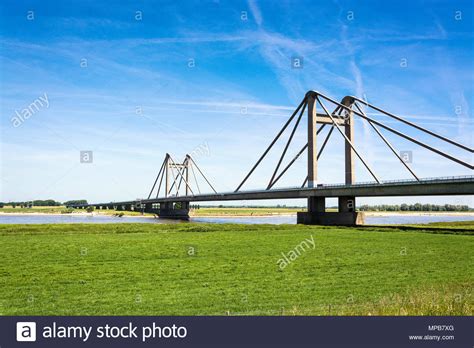 Dutch Landscape With Bridge Over The River Waal In The Netherlands