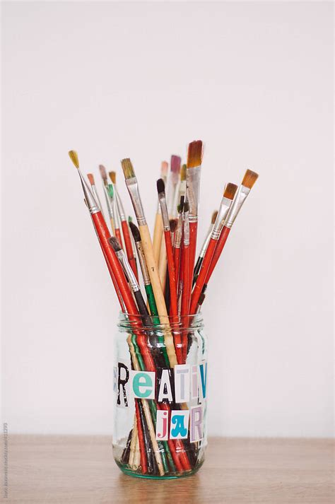 Creative Jar Filled With Paint Brushes By Stocksy Contributor Boris