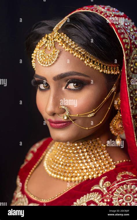 Young Attractive Indian Female Model Dressed In Traditional Indian Lehenga Choli Costume With