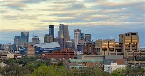 Minneapolis, the largest city in the u.s. Minneapolis Skyline With Minnesota Vikings Us Bank Stadium ...