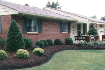 Many shrubs provide blossoms in spring and turn color in the fall, add more visual attention to a property. suburban landscaping | Ranch house landscaping, Home ...