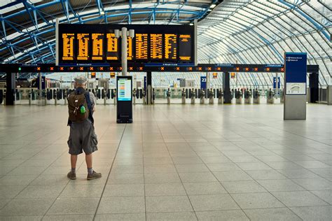 Person Standing Inside Airport Building · Free Stock Photo