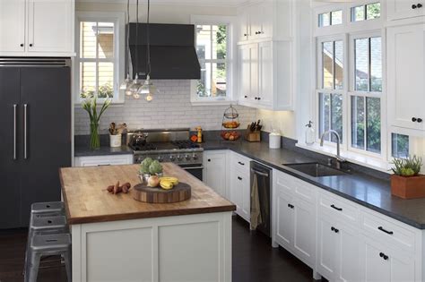 Contemporary kitchen with european style doors and marble kitchen countertop. Black Refrigerator - Transitional - kitchen - Artistic ...