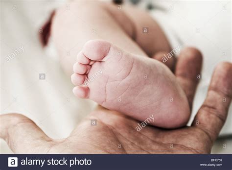 Hand Holding Babies Toes Hi Res Stock Photography And Images Alamy