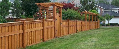 A wooden design adds a rustic appeal to any home, but the metal posts allow a measure of sturdiness. Wood Fences Design Ideas