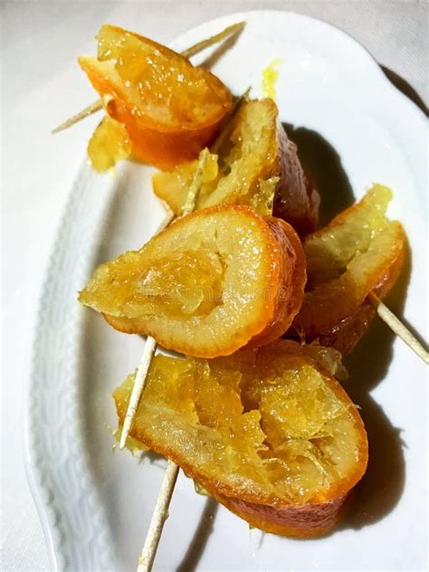Caramelized Orange Slices Stuffed Into A Wooden Toothpick For Appetizer