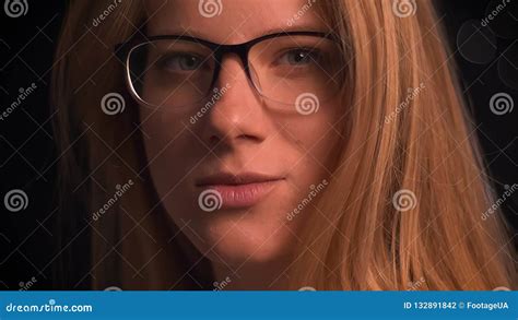Pretty Close Up Face Of Spectacled Caucasian Blonde Woman Turning Her