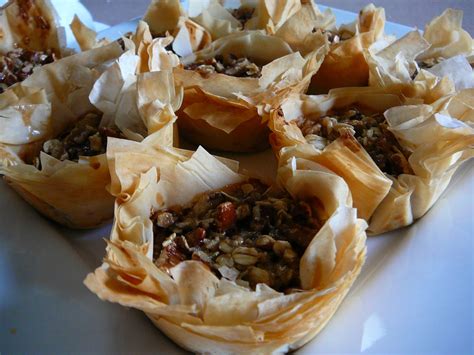 Chicken phyllo turnovers recipe this appetizer is based on bisteeya, a traditional moroccan pastry that pairs savory, spiced meat and flaky phyllo with a dusting of cinnamon and powdered sugar. Eighty Twenty: 20(ish)--- Pecan Pie Tartlets