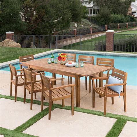 It arrived quickly and was packed well. Noble House Teak Brown 9-Piece Wood Rectangular Outdoor ...