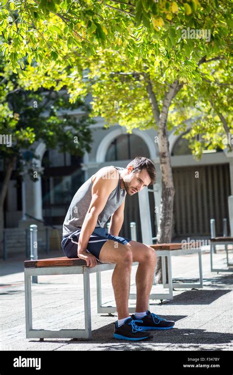 Exhausted Athlete Resting On A Bench Stock Photo Alamy