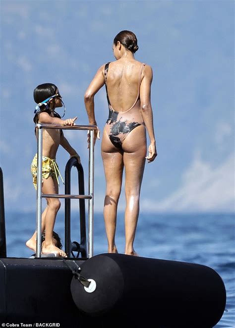 Zoe Saldana Showcases Her Incredible Figure In A Nude Swimsuit As She