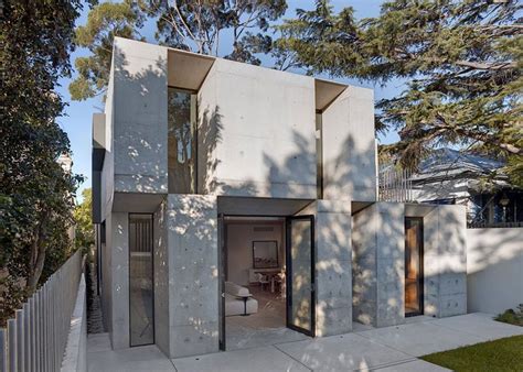 Chunky Concrete Slabs Alternate With Deeply Recessed Windows On The