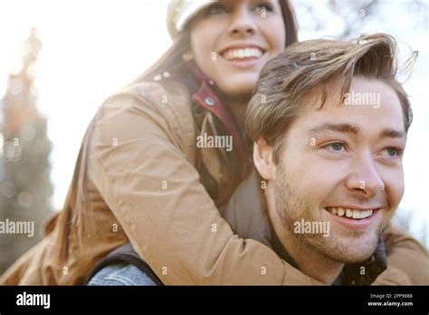 Having Some Fun Together A Young Man Piggybacking His Girlfriend While