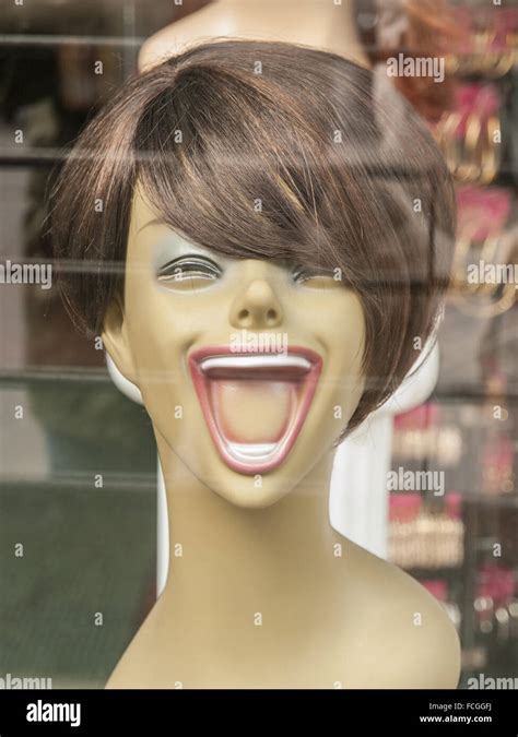 Laughing Mannequin With Brown Wig Short Hair And Pink Lipstick In Store
