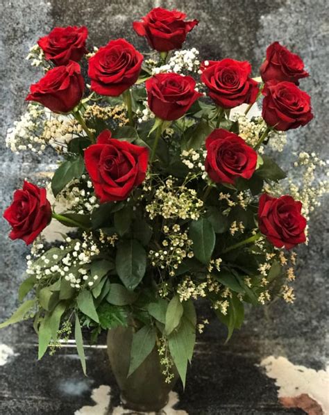 Dozen Red Roses Long Stemmed Arranged And Dressed With Filler In Fort