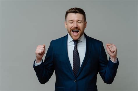 Premium Photo Excited Businessman In Suit Screaming And Celebrating