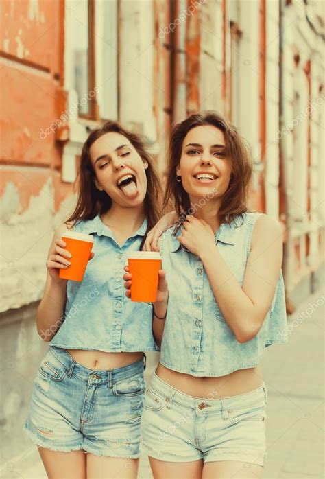 Girls Drinking Coffee On The Street — Stock Photo © Sergeycauselove
