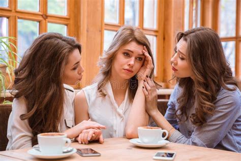Two Women Comforting Crying Girl In Cafe Stock Photo Image Of Cafe