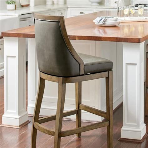 Restoration hardware french t back stools sit in front of a reclaimed wood bar fitted with a concrete countertop lit by bronze light pendants hung from a red brick barrel ceiling accenting stone covered walls. Ellis Textured Swivel Bar & Counter Stool in 2020 ...